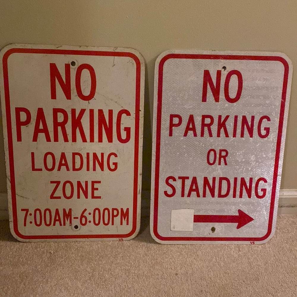2 NO PARKING signs